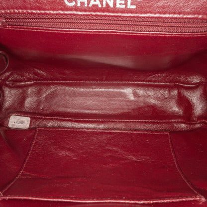 Chanel CC Quilted Lambskin Kiss Lock Frame Top Handle Bag